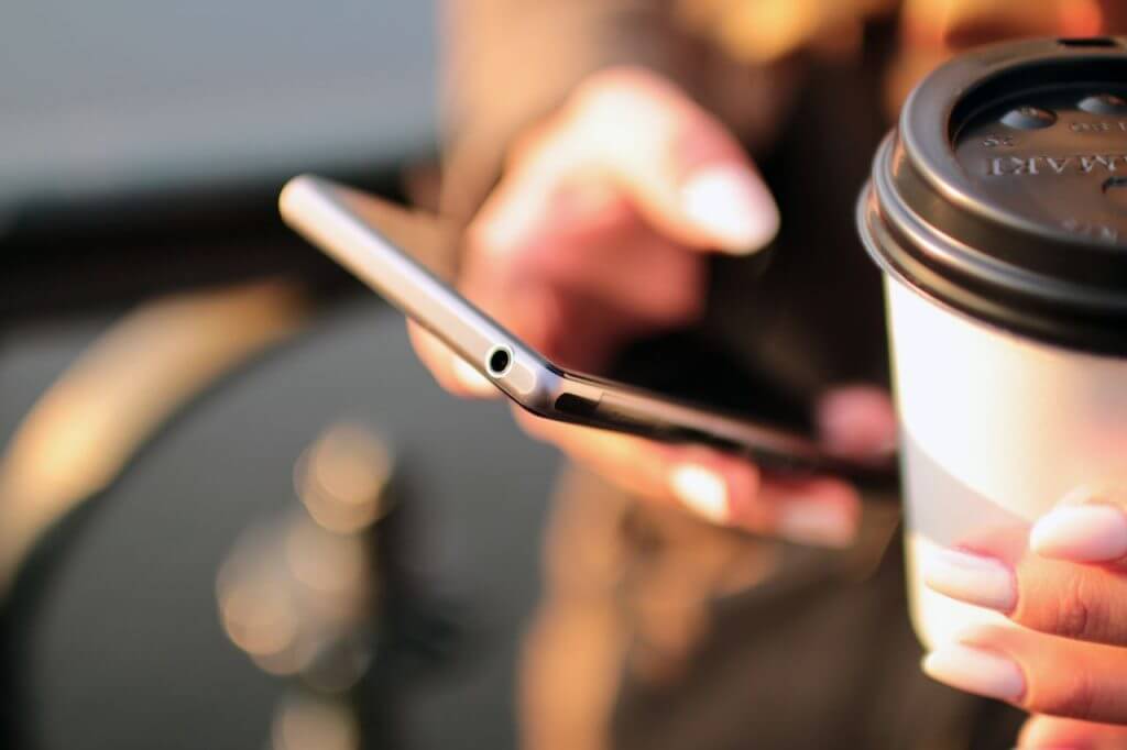 person-holding-smartphone-4831-1024x682-5RNaiMb7zn7Rv4jYUpbv